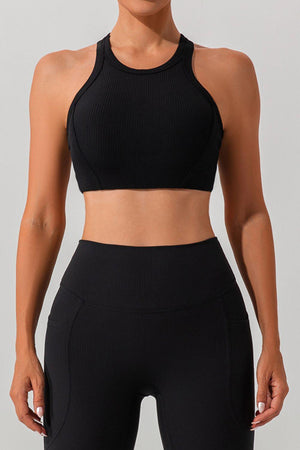 a woman wearing a black sports bra top