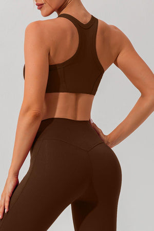 a woman in a brown sports bra top and leggings