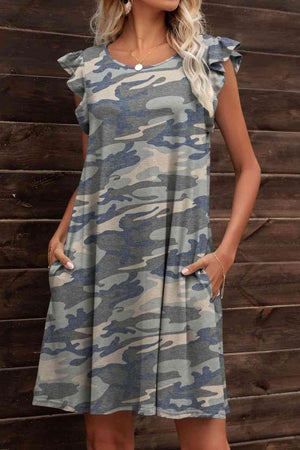 a woman standing in front of a wooden wall