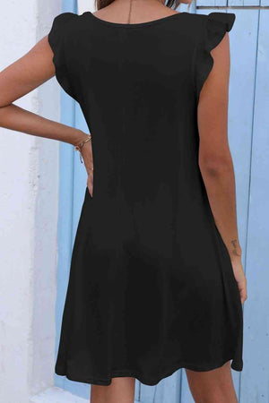 the back of a woman wearing a black dress