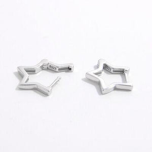 a pair of silver cufflinks on a white background