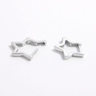 a pair of silver cufflinks on a white background