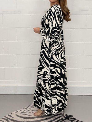 a woman standing on a zebra print rug