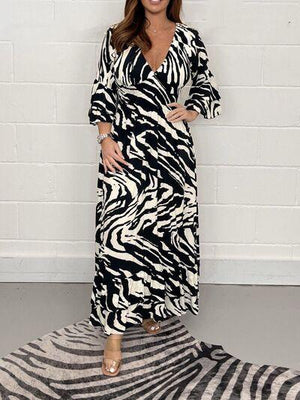 a woman standing on a zebra print rug