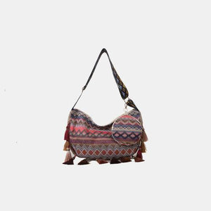 a multicolored bag with tassels hanging from it