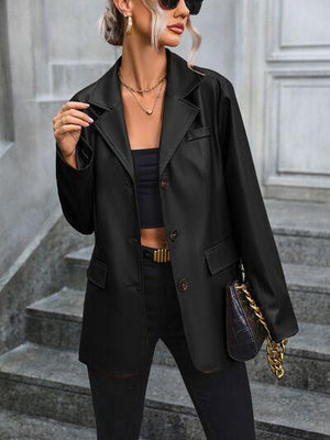 a woman wearing a black jacket and black pants