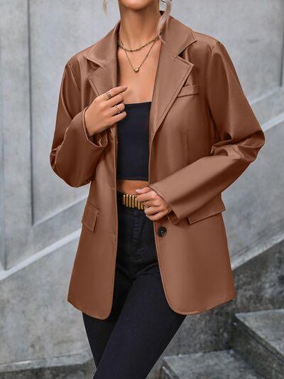 a woman wearing a brown jacket and black pants