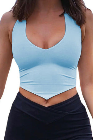 a woman wearing a blue top and black skirt