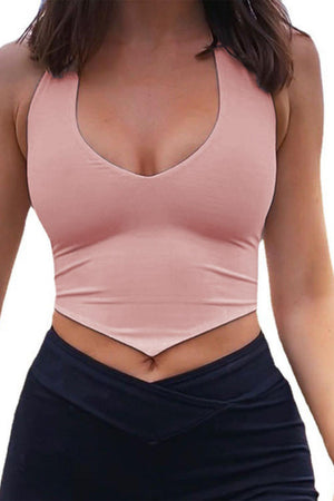 a woman wearing a pink top and black skirt