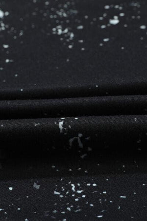 a close up of a black fabric with white speckles