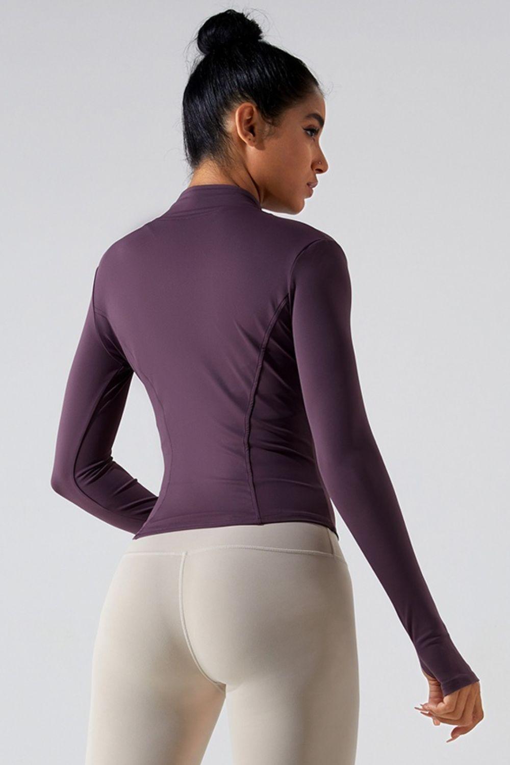 a woman in tight pants and a purple top