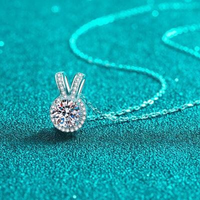 a necklace with a diamond in the shape of a rabbit
