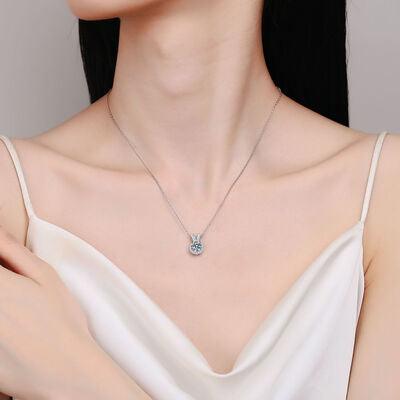 a woman in a white dress wearing a diamond necklace