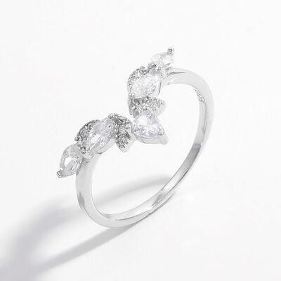 a white gold ring with three pear shaped diamonds