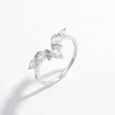 a white gold ring with three pear shaped diamonds