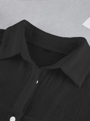 a close up of a black shirt on a table