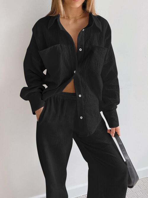 a woman wearing a black shirt and pants