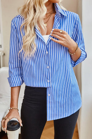 a woman wearing a blue and white striped shirt