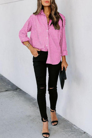 a woman wearing a pink and white striped shirt
