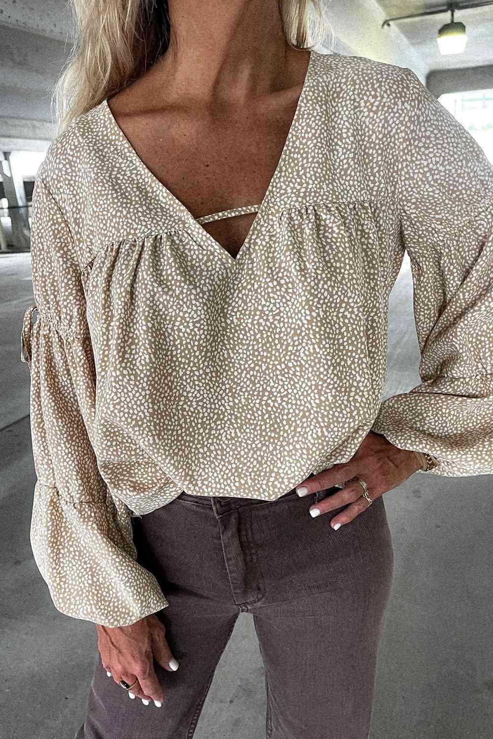 a woman wearing a white blouse and brown pants