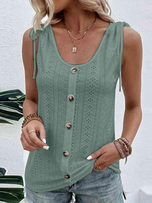 a woman wearing a green tank top