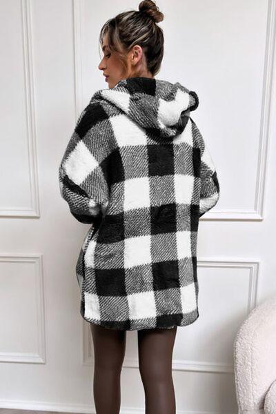 a woman wearing a black and white checkered coat