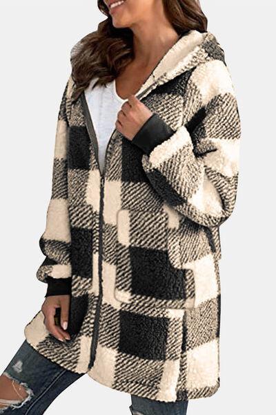 a woman wearing a black and white checkered coat