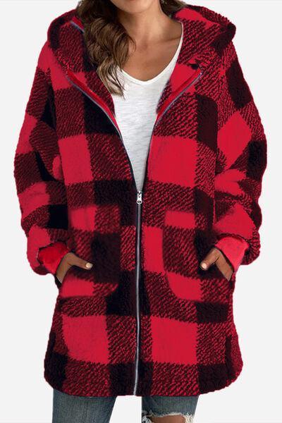 a woman wearing a red and black checkered coat