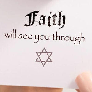 a person holding a piece of paper with a message on it