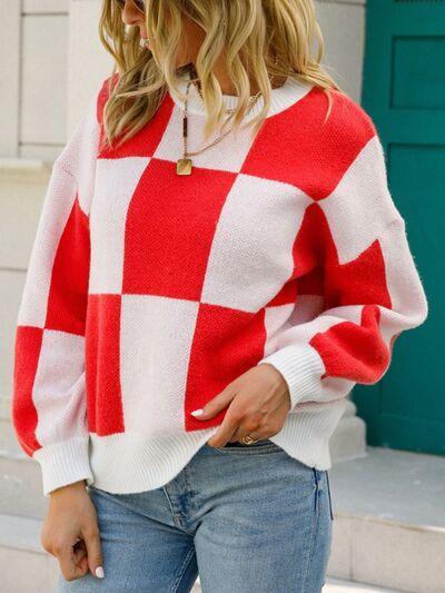 a woman wearing a red and white checkered sweater