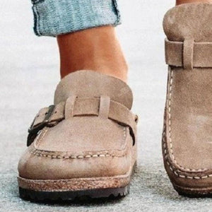 a close up of a person wearing a pair of shoes