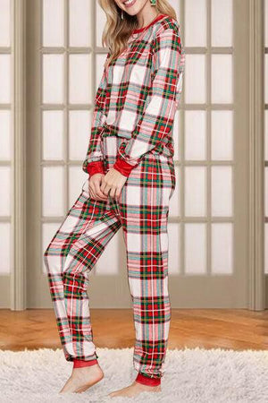 a woman in a red and white plaid pajamas