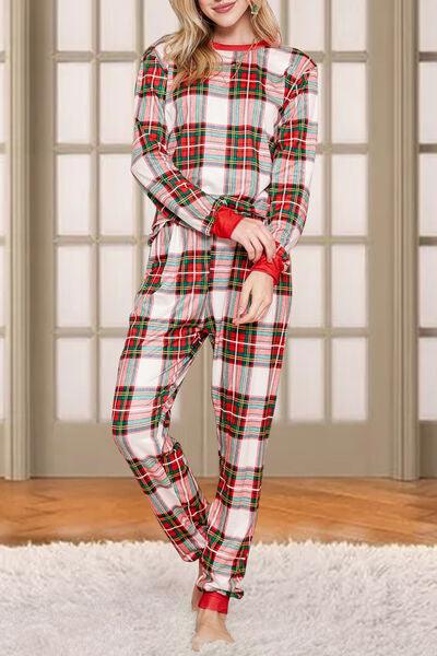 a woman in a red and white plaid pajamas