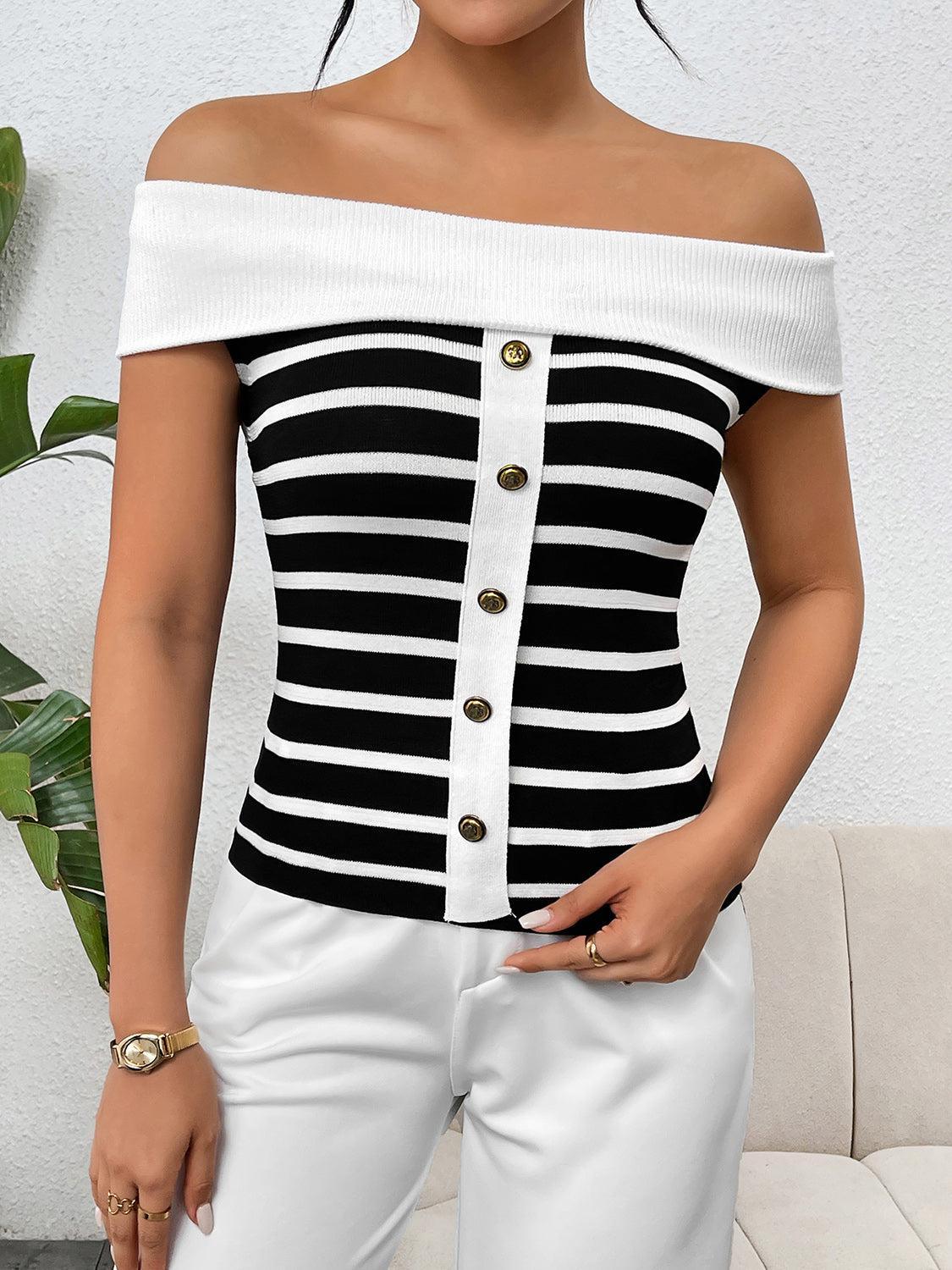 a woman wearing a black and white striped top