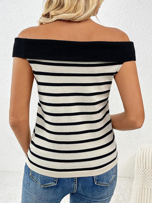 a woman wearing a black and white striped top