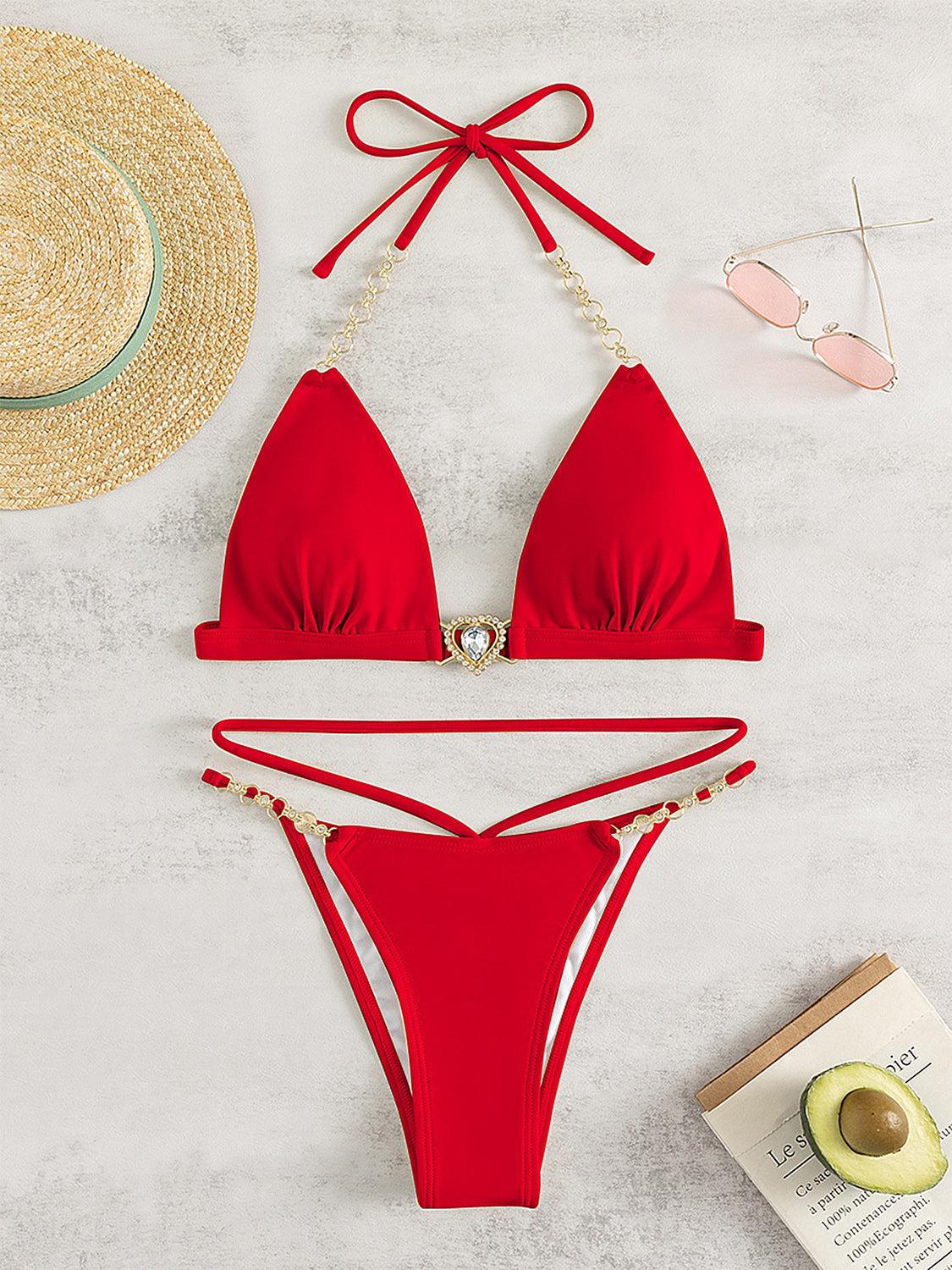 a red bikini top and a straw hat