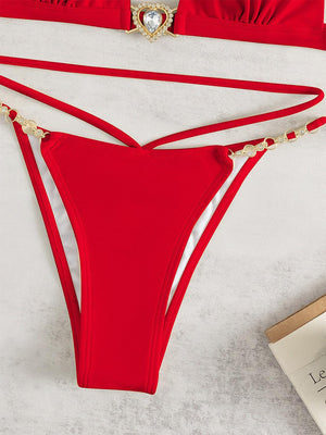 a woman's red bikinisuit with a tie around the waist