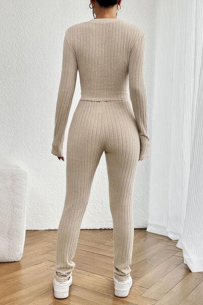 a woman in a beige sweater and pants