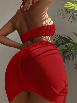 a woman in a red dress with her back to the camera
