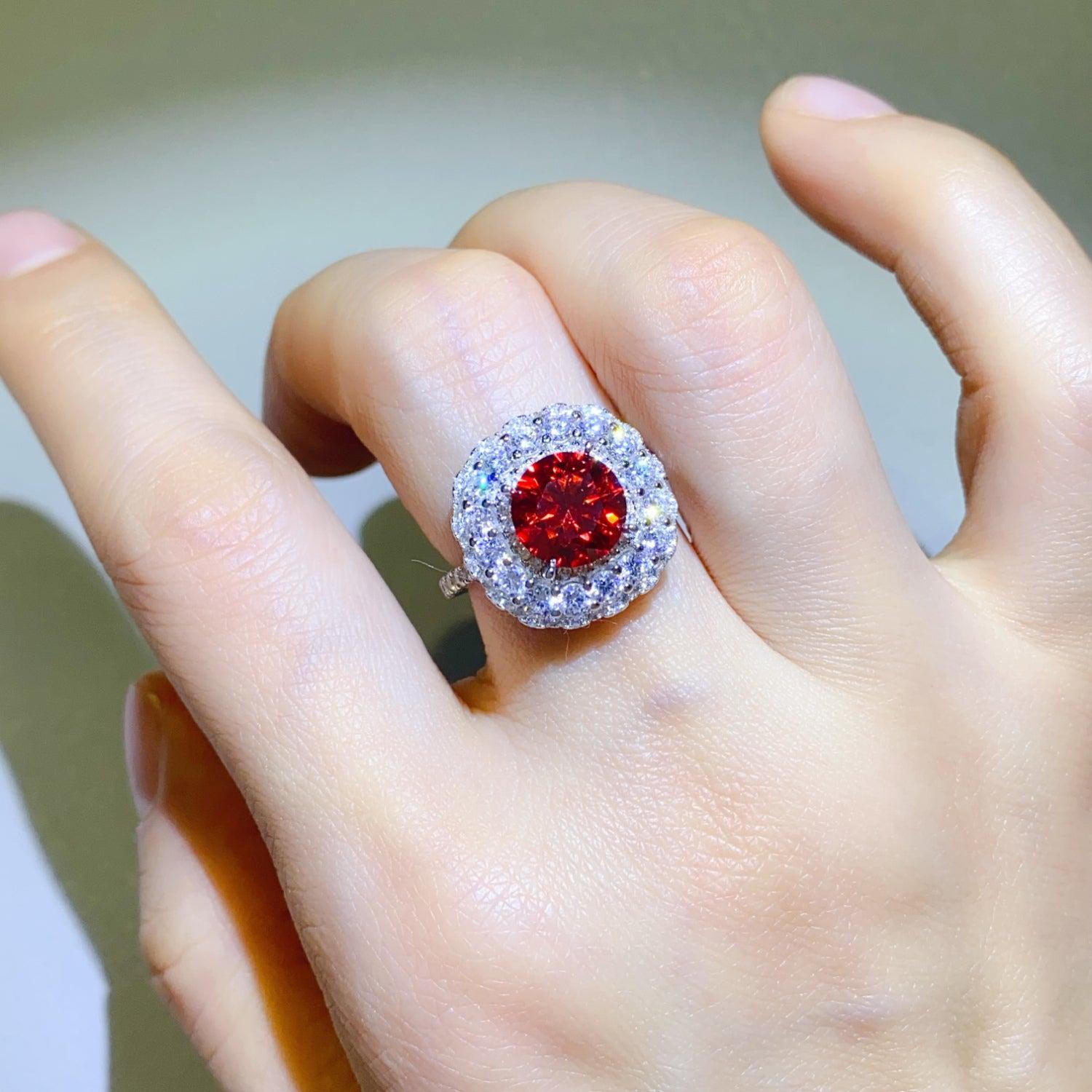 a close up of a person's hand with a ring on it