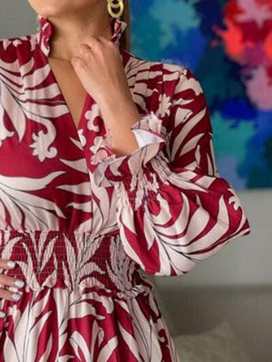 a woman in a red and white dress posing for a picture