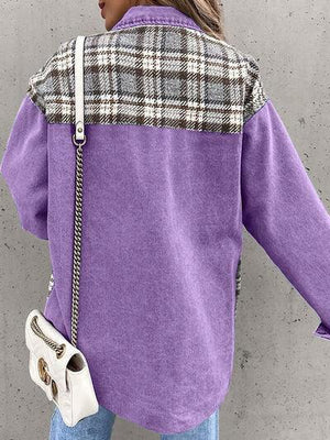 a woman wearing a purple shirt and jeans