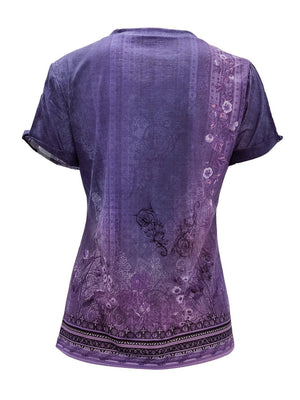 a women's purple top with a floral design