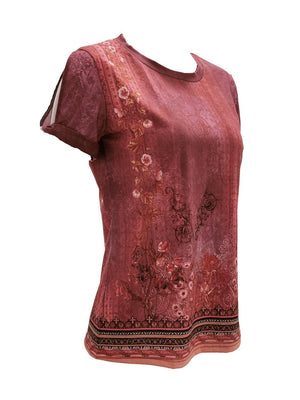 a women's top with a floral design on it