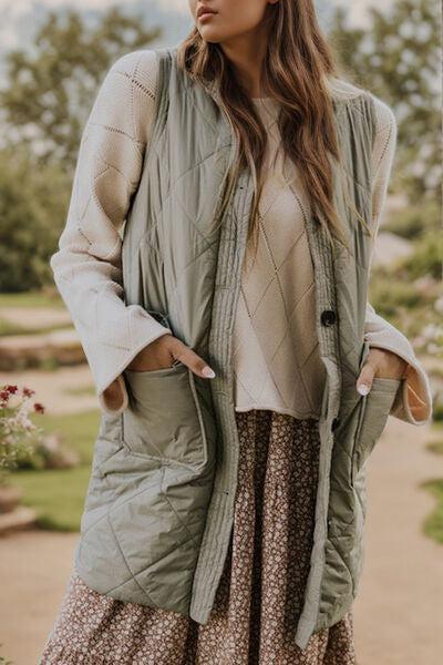 a woman standing on a sidewalk wearing a green vest