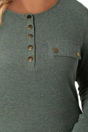 a woman wearing a green top with buttons