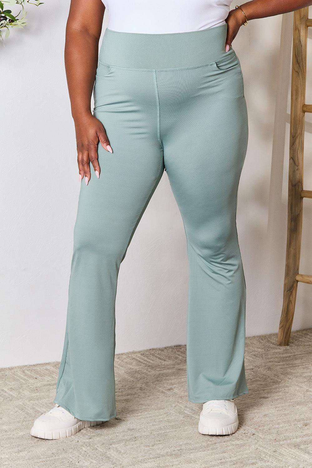 a woman in a white top and blue pants