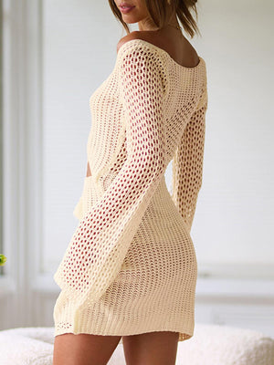 a woman standing on a bed in a short dress