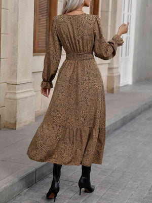 a woman in a brown dress is walking down the street
