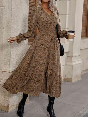 a woman wearing a brown dress and black boots